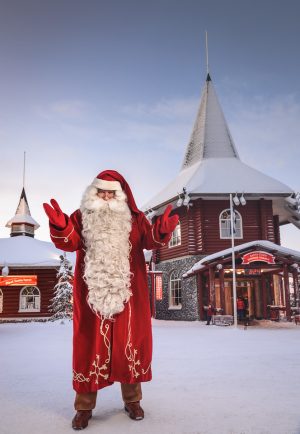 Santa Claus in front of Christmas House in Santa Claus Village in Rovaniemi